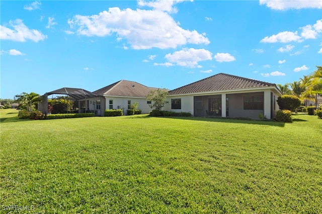 13593 Starwood Ln, Fort Myers, FL 33912 - back of house with a lawn and stucco siding