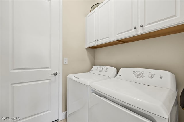 13593 Starwood Ln, Fort Myers, FL 33912 - laundry area featuring washing machine and dryer and cabinet space