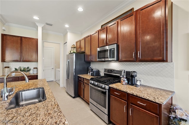 13593 Starwood Ln, Fort Myers, FL 33912 - kitchen featuring appliances with stainless steel finishes, light stone counters, crown molding, backsplash, and recessed lighting