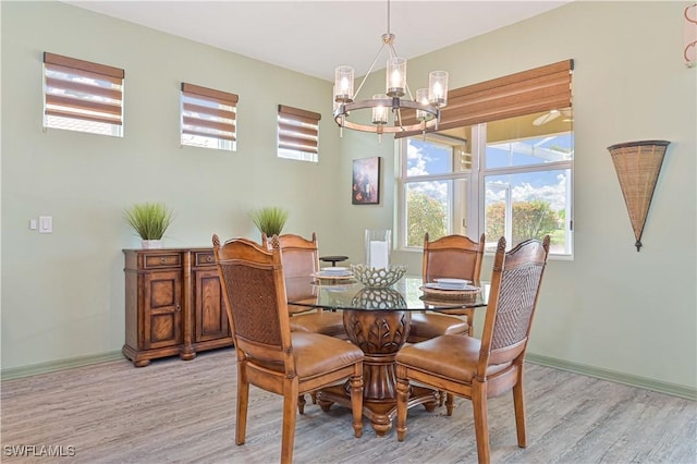 3344 Apple Blossom Dr, Alva, FL 33920 - dining room featuring a chandelier, light wood-style floors, and plenty of natural light