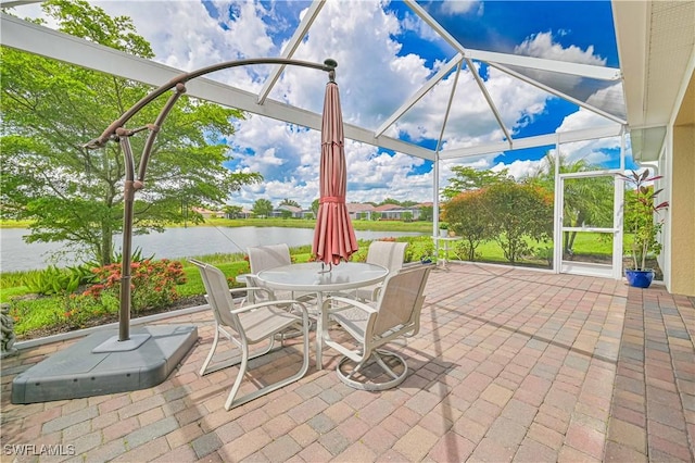 3344 Apple Blossom Dr, Alva, FL 33920 - view of patio / terrace with a water view, glass enclosure, and outdoor dining space