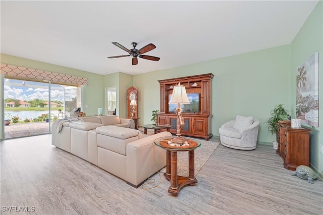 3344 Apple Blossom Dr, Alva, FL 33920 - living room with wood finished floors, ceiling fan, and a water view