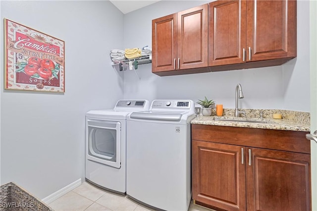 3344 Apple Blossom Dr, Alva, FL 33920 - laundry area featuring independent washer and dryer, light tile patterned floors, and cabinet space