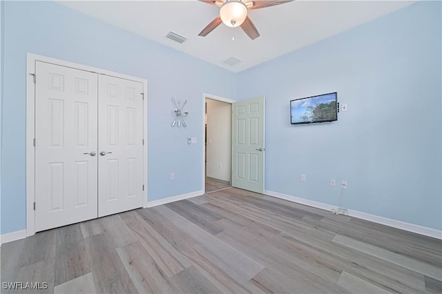 3344 Apple Blossom Dr, Alva, FL 33920 - unfurnished bedroom with wood finished floors, a closet, and a ceiling fan