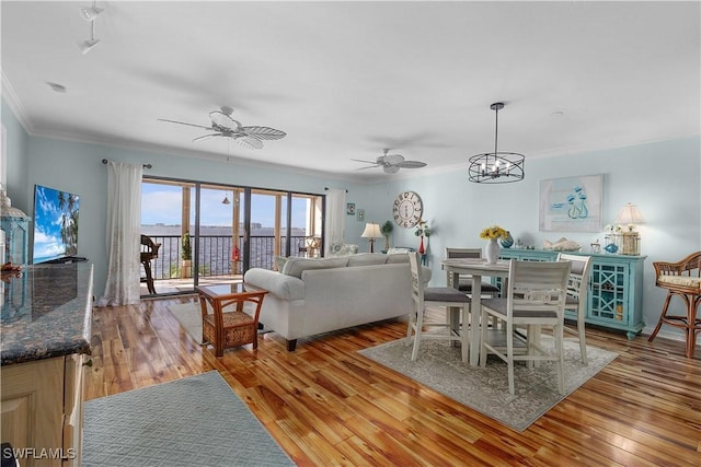 1925 Clifford St Unit 202, Fort Myers, FL 33901 - living room with a ceiling fan, crown molding, and light wood-style flooring