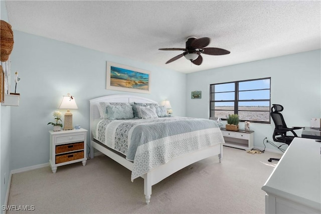 1925 Clifford St Unit 202, Fort Myers, FL 33901 - bedroom with light colored carpet, a textured ceiling, and a ceiling fan