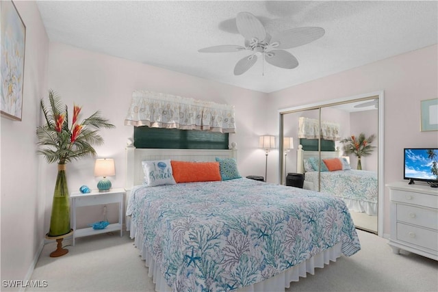 1925 Clifford St Unit 202, Fort Myers, FL 33901 - bedroom with carpet flooring, a closet, ceiling fan, and a textured ceiling
