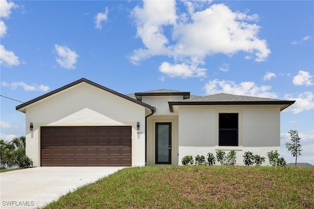 7007 Ramrod Cir, Labelle, FL 33935 - view of front of property featuring an attached garage, stucco siding, concrete driveway, and a front lawn