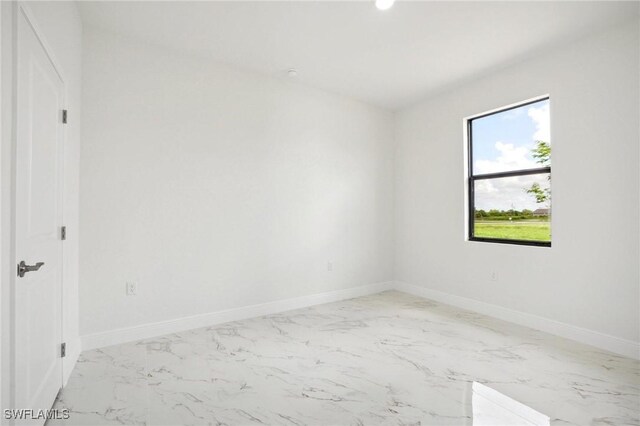 7007 Ramrod Cir, Labelle, FL 33935 - spare room featuring marble finish floors and baseboards