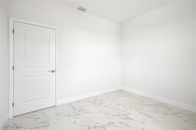 7007 Ramrod Cir, Labelle, FL 33935 - spare room with light marble finish flooring and baseboards