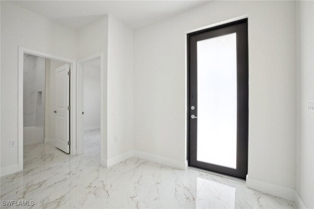 7007 Ramrod Cir, Labelle, FL 33935 - spare room featuring marble look tiles and baseboards