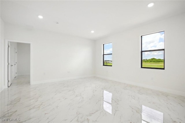 7007 Ramrod Cir, Labelle, FL 33935 - empty room with recessed lighting and light marble finish flooring