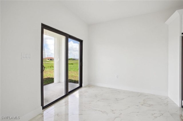 7007 Ramrod Cir, Labelle, FL 33935 - empty room with light marble finish floors and plenty of natural light