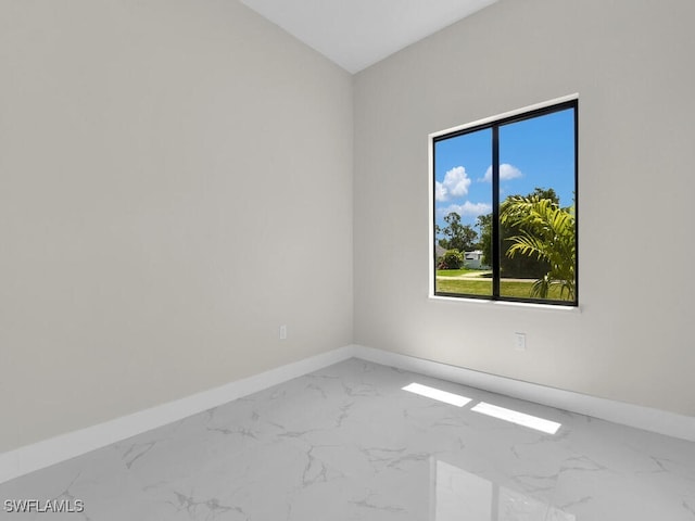 1304 Williams Ave, Lehigh Acres, FL 33972 - unfurnished room with marble look tiles and baseboards