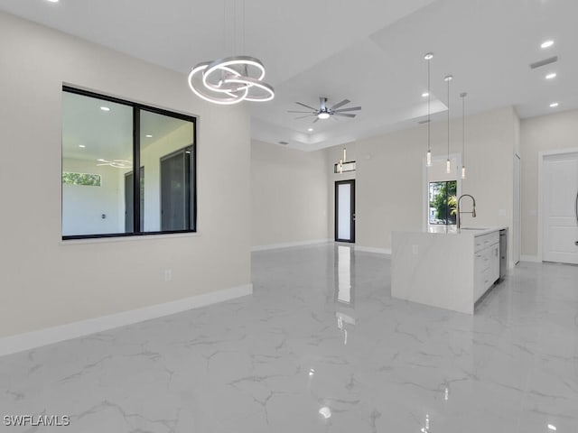 1304 Williams Ave, Lehigh Acres, FL 33972 - unfurnished living room featuring a ceiling fan, a chandelier, recessed lighting, and light marble finish flooring