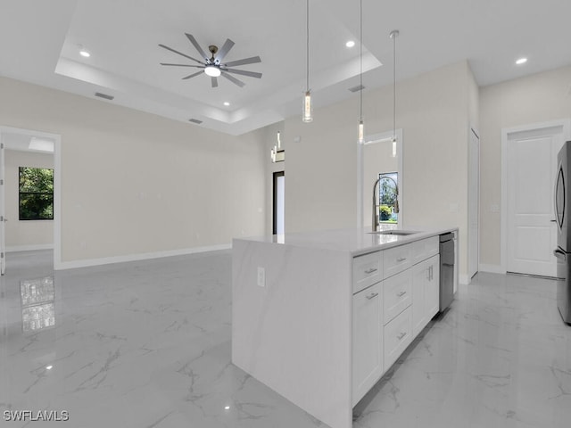 1304 Williams Ave, Lehigh Acres, FL 33972 - kitchen featuring open floor plan, a raised ceiling, light marble finish flooring, ceiling fan, and refrigerator