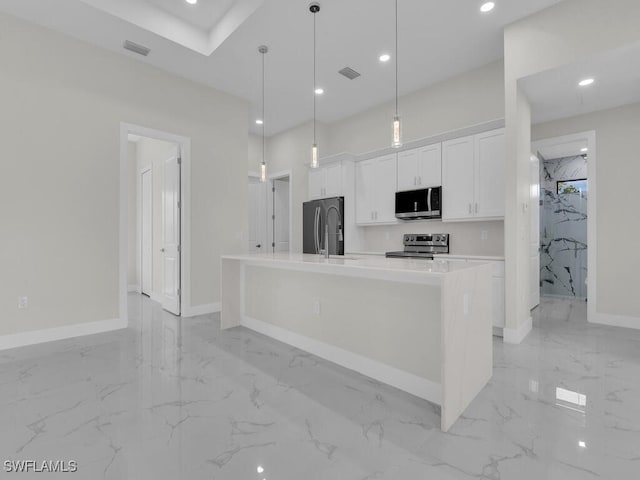 1304 Williams Ave, Lehigh Acres, FL 33972 - kitchen featuring appliances with stainless steel finishes, light marble finish floors, white cabinets, light countertops, and recessed lighting