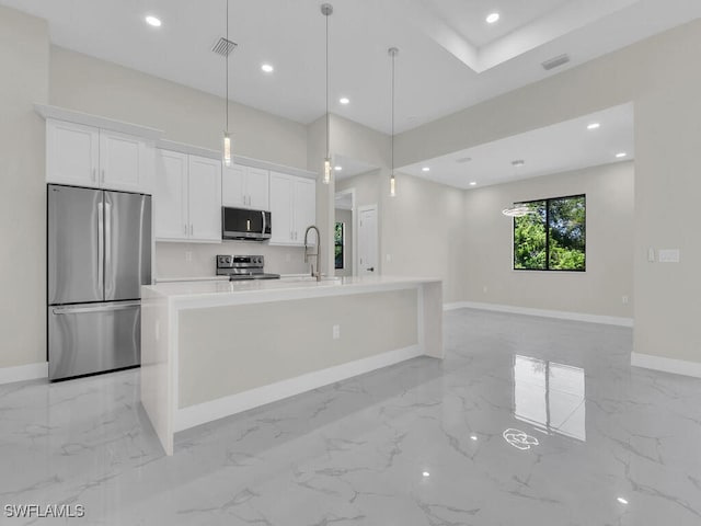 1304 Williams Ave, Lehigh Acres, FL 33972 - kitchen with appliances with stainless steel finishes, light marble finish flooring, white cabinetry, and recessed lighting