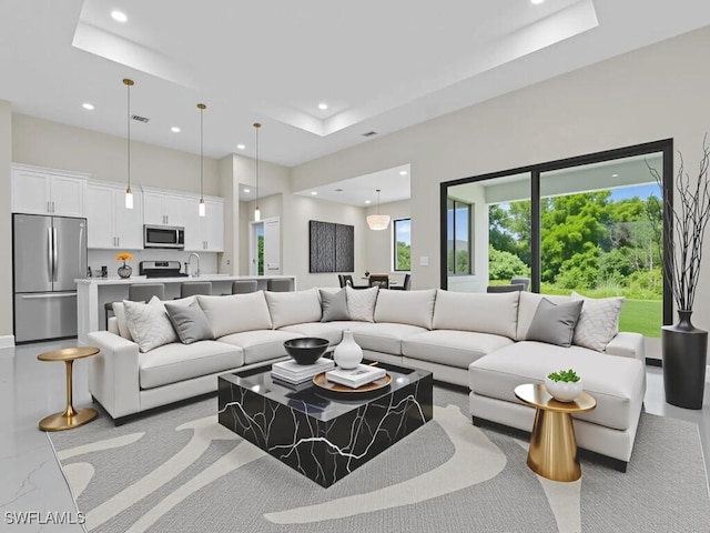 1304 Williams Ave, Lehigh Acres, FL 33972 - living room with recessed lighting, a raised ceiling, a high ceiling, and carpet floors