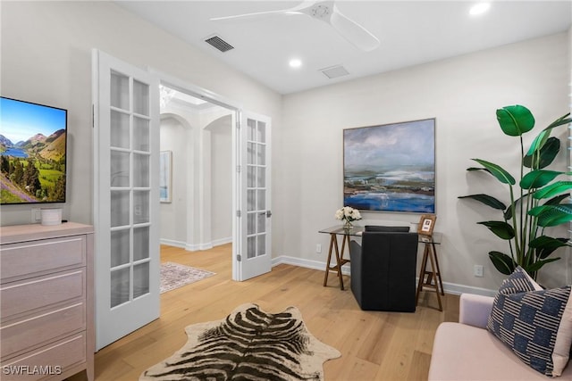 8834 Vaccaro Ct, Naples, FL 34119 - home office with french doors, light wood-type flooring, recessed lighting, ceiling fan, and arched walkways