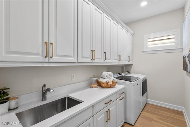 8834 Vaccaro Ct, Naples, FL 34119 - washroom with separate washer and dryer, cabinet space, light wood-style flooring, and recessed lighting