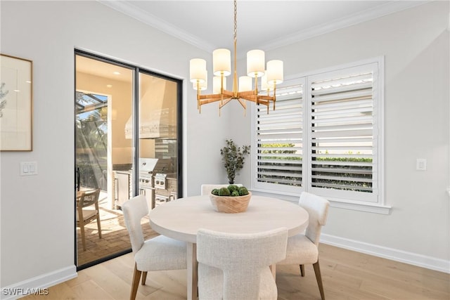 8834 Vaccaro Ct, Naples, FL 34119 - dining area featuring a chandelier, healthy amount of natural light, ornamental molding, and light wood-type flooring