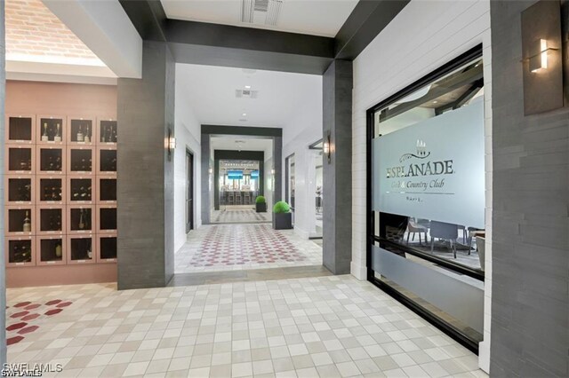 8834 Vaccaro Ct, Naples, FL 34119 - hallway with light tile patterned flooring