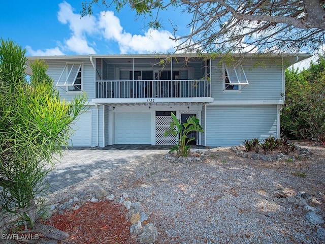 1132 Bond Ct, Marco Island, FL 34145 - view of front of house with an attached garage and driveway