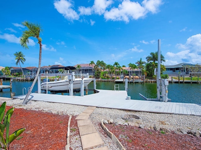 1132 Bond Ct, Marco Island, FL 34145 - dock area featuring boat lift, a water view, and a residential view