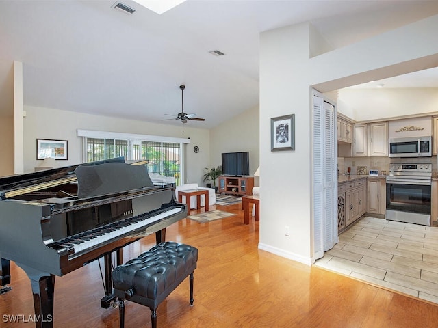 1132 Bond Ct, Marco Island, FL 34145 - sitting room with light wood-style floors, ceiling fan, and vaulted ceiling