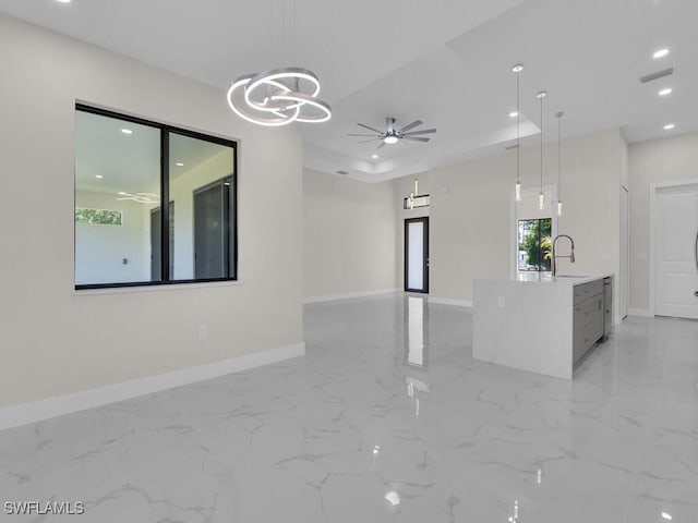 503 Lincoln Blvd, Lehigh Acres, FL 33936 - unfurnished living room featuring a ceiling fan, a chandelier, recessed lighting, and light marble finish flooring