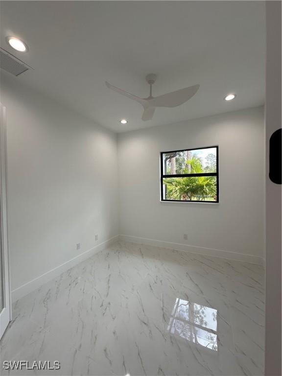 491 9th St SW, Naples, FL 34117 - unfurnished room featuring ceiling fan, recessed lighting, and marble finish floors