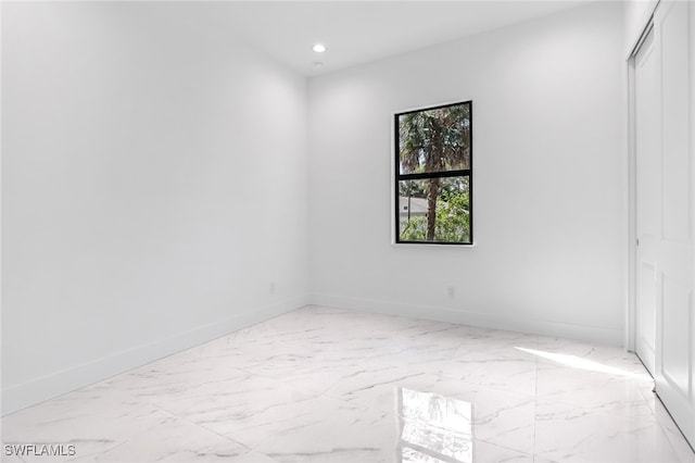 491 9th St SW, Naples, FL 34117 - spare room with recessed lighting and light marble finish floors