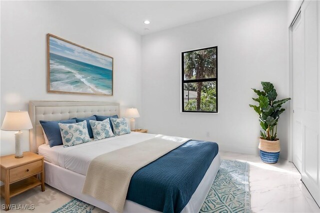 491 9th St SW, Naples, FL 34117 - bedroom with recessed lighting and light marble finish floors