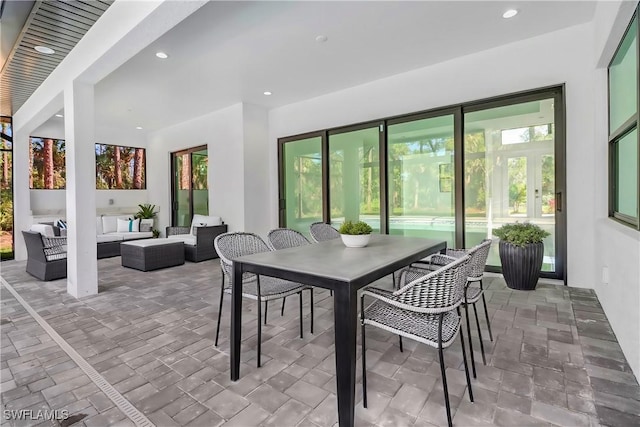 491 9th St SW, Naples, FL 34117 - view of patio / terrace with an outdoor hangout area and outdoor dining space