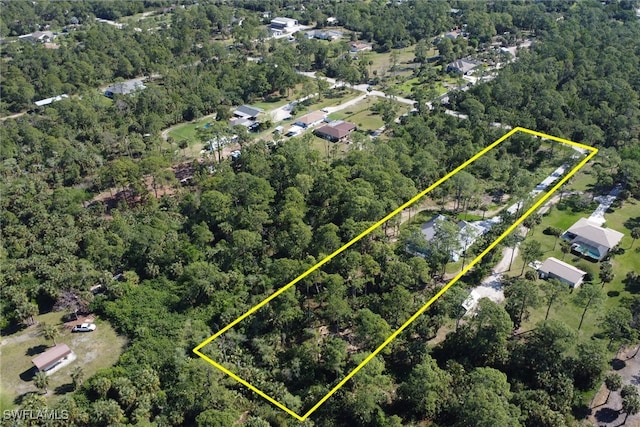 491 9th St SW, Naples, FL 34117 - aerial view of property's location featuring property boundaries highlighted and a heavily wooded area