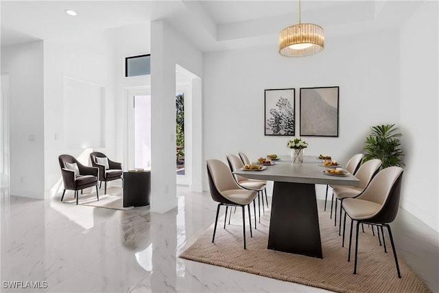 491 9th St SW, Naples, FL 34117 - dining space with a high ceiling, marble tiled floors, a tray ceiling, and recessed lighting