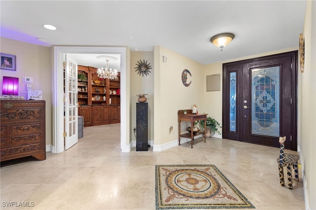 1920 Virginia Ave Unit 1102, Fort Myers, FL 33901 - foyer entrance featuring a chandelier and baseboards