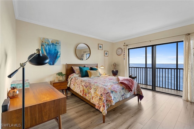 1920 Virginia Ave Unit 1102, Fort Myers, FL 33901 - bedroom with access to outside, a water view, wood finished floors, and crown molding