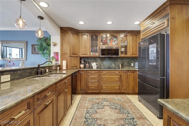 1920 Virginia Ave Unit 1102, Fort Myers, FL 33901 - kitchen featuring appliances with stainless steel finishes, brown cabinetry, decorative backsplash, light stone countertops, and recessed lighting