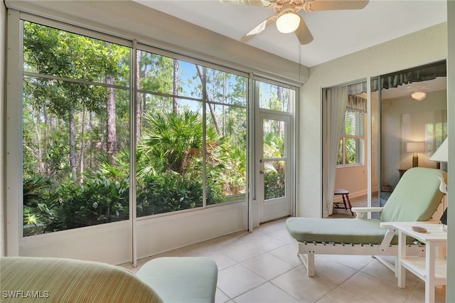 857 Carrick Bend Cir Unit 101, Naples, FL 34110 - sunroom featuring tile patterned flooring and a ceiling fan