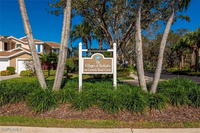 857 Carrick Bend Cir Unit 101, Naples, FL 34110 - community sign with a garage