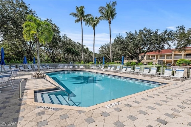 857 Carrick Bend Cir Unit 101, Naples, FL 34110 - community pool with a patio area