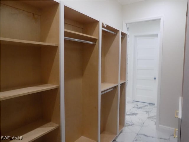 2924 Dunbar Ave, Fort Myers, FL 33916 - walk in closet featuring marble look tiles