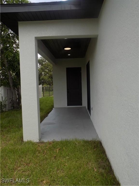 2924 Dunbar Ave, Fort Myers, FL 33916 - view of exterior entry featuring stucco siding