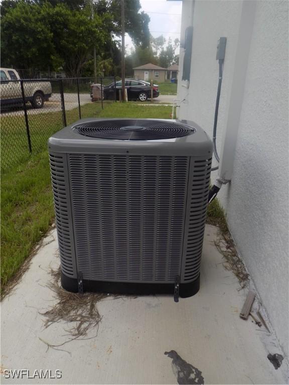 2924 Dunbar Ave, Fort Myers, FL 33916 - exterior view of a cooling unit and stucco siding