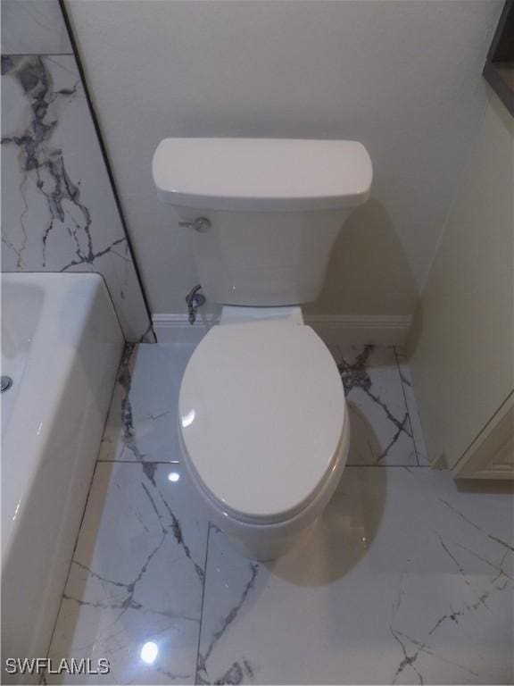 2924 Dunbar Ave, Fort Myers, FL 33916 - full bathroom with marble look tiles and a bathtub