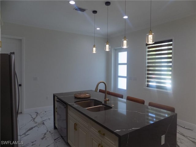 2924 Dunbar Ave, Fort Myers, FL 33916 - kitchen with stainless steel appliances, light marble finish floors, an island with sink, pendant lighting, and recessed lighting