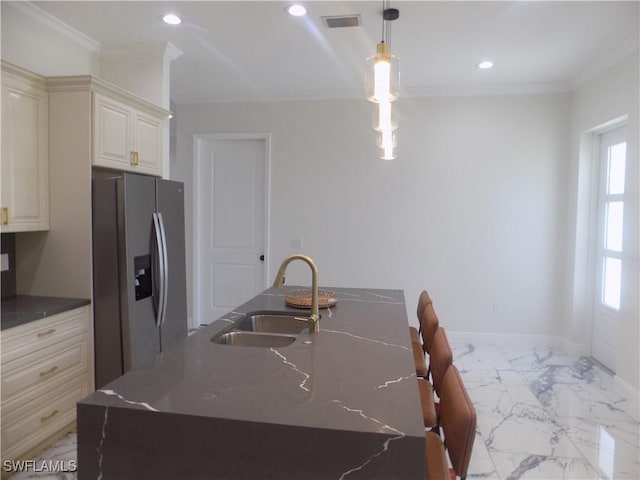 2924 Dunbar Ave, Fort Myers, FL 33916 - kitchen featuring stainless steel refrigerator with ice dispenser, light marble finish floors, crown molding, recessed lighting, and cream cabinetry