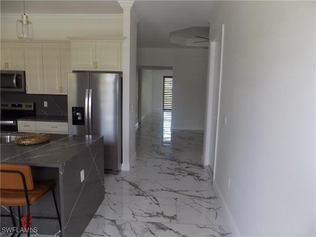 2924 Dunbar Ave, Fort Myers, FL 33916 - kitchen with appliances with stainless steel finishes, light marble finish flooring, decorative backsplash, a kitchen bar, and cream cabinets